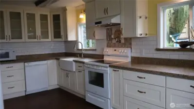 Fully updated kitchen with pantry, granite countertops, and a pot filler.
