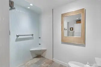 Walk-in shower with a seat.