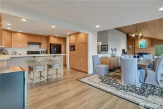 Kitchen is off the dining area. Eating bar between dining room and kitchen.