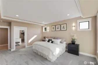 This retreat offers an attached large walk in closet and bathroom with custom shower, dual vanities and additional "make up" vanity