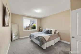 This ensuite room is perfect private quarters for guest with attached 3/4 bath and walk in closet