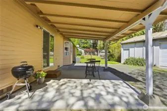 Enjoy a peaceful setting with mature landscaping and expansive grounds offering endless possibilities for outdoor living, storage, or future projects