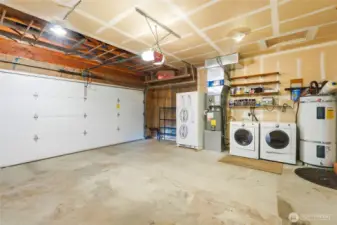 Attached 2-car garage with washer and dryer, storage and the home is wired for generator