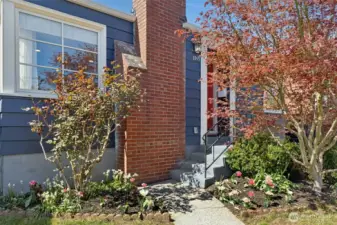 Beautiful landscaping leads you up to the front door. Oh- and the whole house was just repainted!