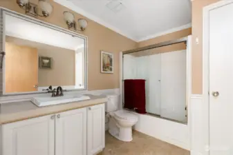 Bathroom on the main floor has tile floors and vanity and includes a linen closet.
