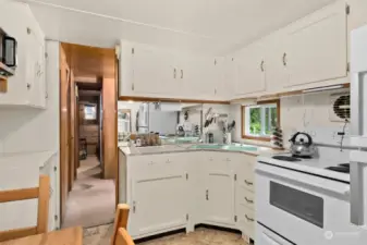 Plenty of storage in this adorable kitchen.