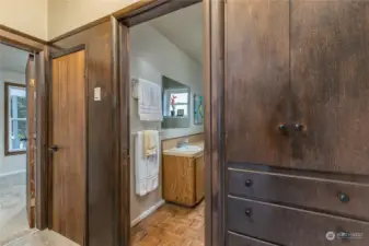 Full bathroom - note the vintage built-in cabinetry in the hall!