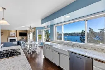 Updated eat-in kitchen with granite counters and farmhouse sink