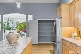 A full-sized pantry offers additional kitchen storage.