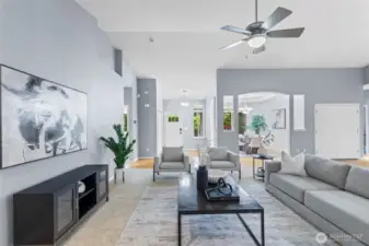 This view provides a better context to the entry way (with a double-door coat closet) and dining room. Add a TV on the wall to the left for watching your favorite sports teams.