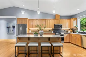 The heart of the home, the kitchen! A large, eat-in-island, granite countertops, and a full tile backsplash are some of the details that make this home desirable. A new refrigerator as well as a recently updated range and microwave make moving in a breeze.
