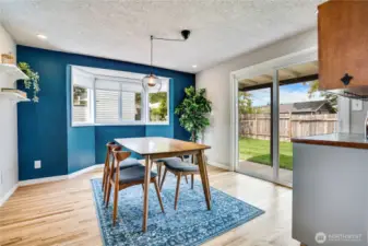 This dining room is basically its own entertainment space with easy access to the backyard, an abundance of natural light and quick access to the built-in wine bar. Note the refinished hardwoods and stylish accent wall. Cheers!