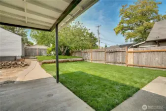 The covered patio off the dining room allows for a comfortable year-round grilling spot and sets the stage for a great al fresco dining experience!