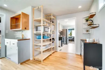 No shortage of storage in this house. From charming built-in shelves and the wine bar to newly added open storage for dried goods and larger cookware.
