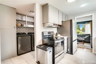 The kitchen flows effortlessly to the laundry room and other side of the house. The vinyl flooring continues through these areas also.