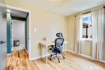 Note the refinished hardwoods flowing through the bedrooms and hallway, and the inset vent covers create a seamless look.