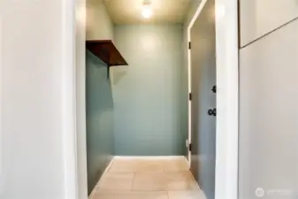 This mud room off the backyard entry door is perfect to hang backpacks, muddy shoes and easily transport groceries to the kitchen!