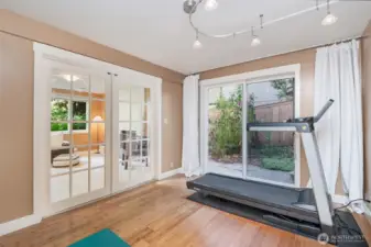 Slider in fifth bedroom for easy access to outside patio with firepit.