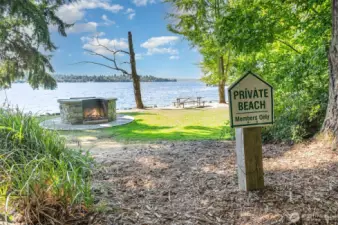 Exclusive access to private beach with over 1100 feet of Lake Washington waterfront, moorage, water slide and diving board, picnic tables and play area and pickleball and tennis courts!