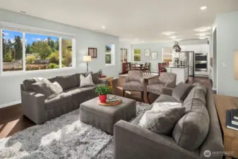 Great room concept with large picture windows to the back yard.