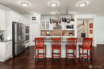 Wonderful open kitchen with double ovens and gas cooking.  Pantry entrance is the door on the left.