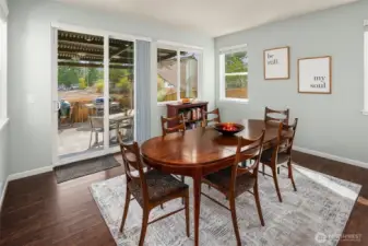 Roomy dining area with sliders to the backyard covered patio.