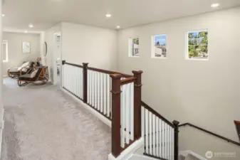 Open loft type bonus room. Everything feels open and airy in this home.  Great light!