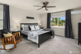 Large primary bedroom.  This bed is a King. There is an additional mini-split in this room beyond the heat pump.