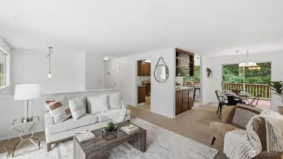 Seamless connection between living, dining, and kitchen spaces creates an inviting flow for gatherings and everyday living