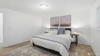 Spacious and tranquil primary retreat designed for relaxation and rejuvenation.