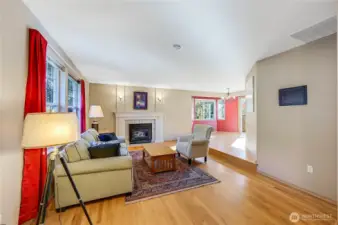 Enter the front door to the sunken living room with real hardwood floors and a cozy propane fireplace to warm your fall evenings.