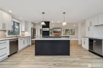 Kitchen with windows to your back, quartz and updated appliances