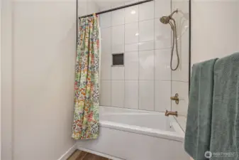 Full bathroom next to bedrooms (across house from primary)