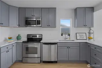 Kitchen with brand new cabinets and quartz countertops