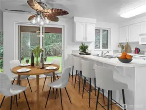 Dining area with space for barstools - virtually staged.