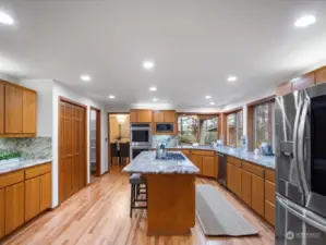 Large kitchen with Chefs island, informal dining area, walk in pantry and secondary pantry area. Double oven and new stainless steel appliances.