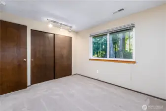 Bedroom 3 facing the green space behind the home.