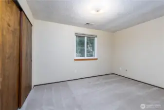 Bedroom 4 facing the green space behind the home.