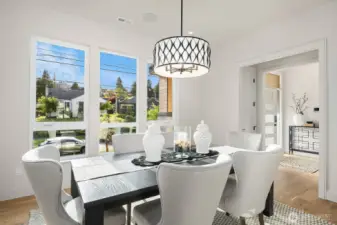 Picture yourself hosting unforgettable gatherings in this elegant Formal Dining Room, offering a sophisticated view of the entrance and the charming front street. Perfect for making a lasting impression on your guests, this space sets the stage for any occasion