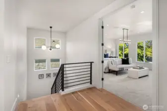 Ascend to the top floor, where you'll discover the expansive Primary Bedroom, featuring a custom-designed bed wall and oversized windows that frame breathtaking territorial views. This serene retreat offers the perfect blend of luxury and tranquility.