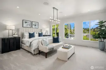 From the Primary Bedroom, enjoy a stunning view towards the elegant beverage station, cozy electric fireplace, and stylish barn door that leads to the bathroom, creating a seamless blend of comfort and sophistication.