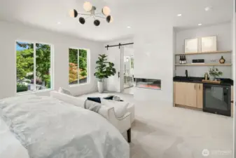 The Primary Bedroom Beverage Station is a true highlight; featuring a sleek sink with a convenient refrigerator, perfect for storing drinks, medications, or natural beauty products. This thoughtfully designed space adds both function and flair to your Sancturay!