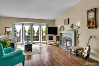 Wall of Windows in the Living Room bringing the Outdoors In with an abundance of Natural Lighting!
