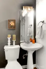 Convenient main floor powder room is perfect for guests and everyday ease.
