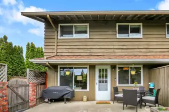Entertain with ease on the spacious patio with direct access to your private driveway for added convenience.