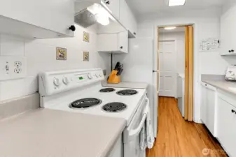 A well equipped cooking zone with classic tile accents.