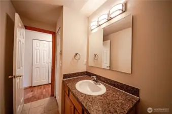 Extra closet space in the bathroom and hallway leading to bedrooms