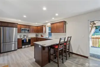 Kitchen with eating space, and room for a large dining table as well.