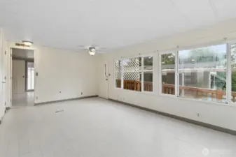 Living room looking at primary bedroom door.