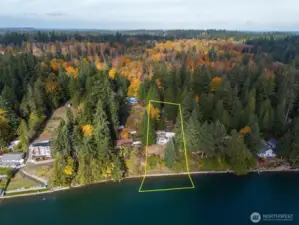 A gradual, landscaped path and new stairs to the bulkhead lead followed by concrete steps to the beach, land you on a smooth gravel beach.  The 1+ acre lot enjoys 107' of waterfront and tidelands.